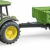 John Deere 5115 M with tipping trailer